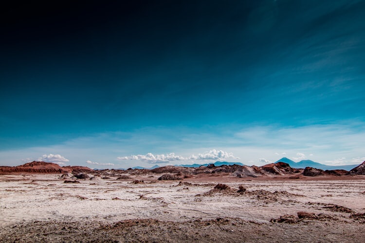 barren land with deep blue sky
